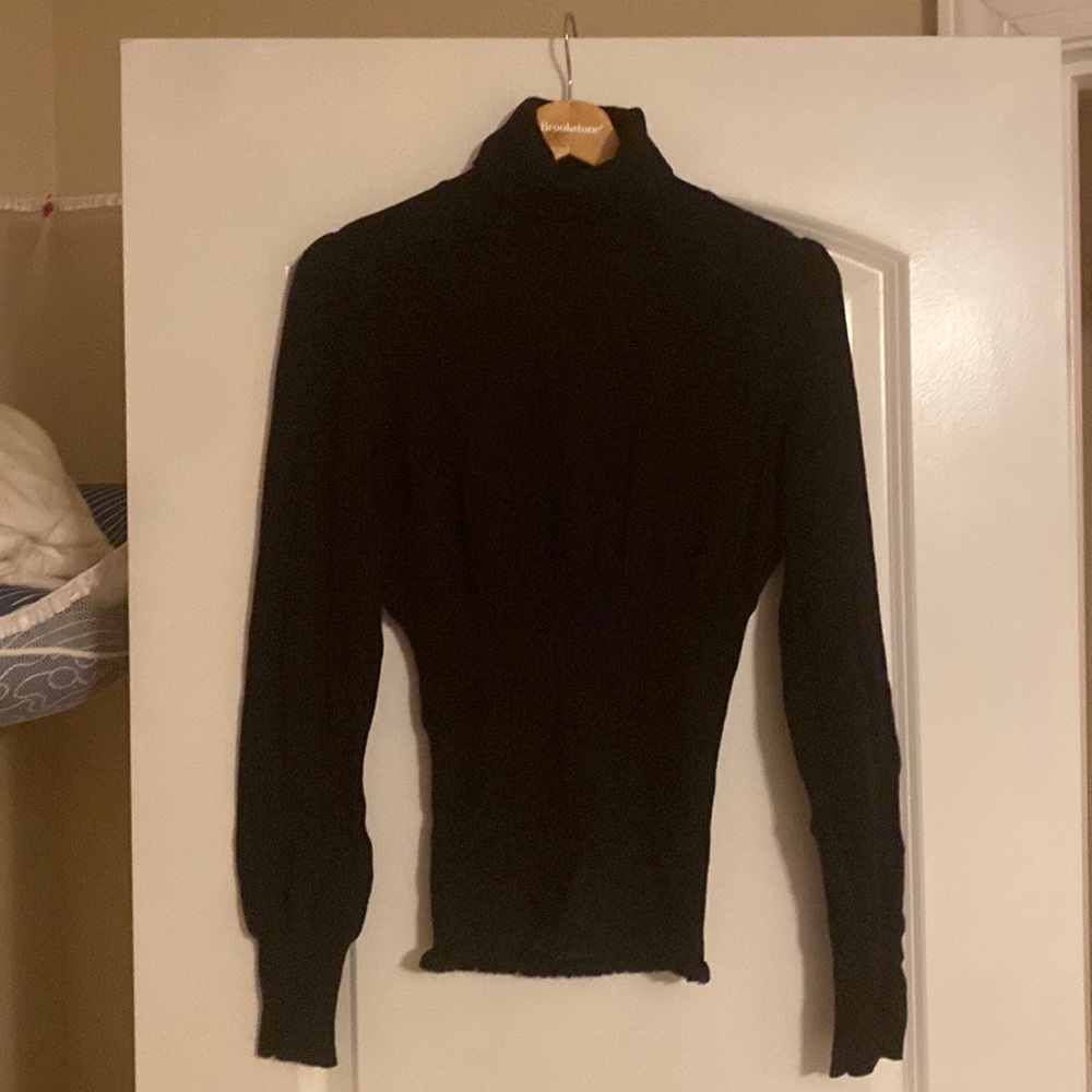 Unique black turtleneck with smoked waist and blouson sleeves